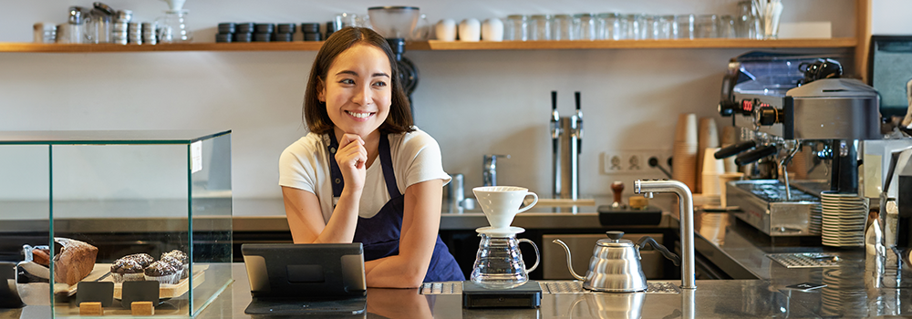 Afbeelding van een barista in een koffiebar